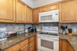upgrade cabinets, granite countertops, microwave, oven-range, blender, coffee maker, cooking amenities